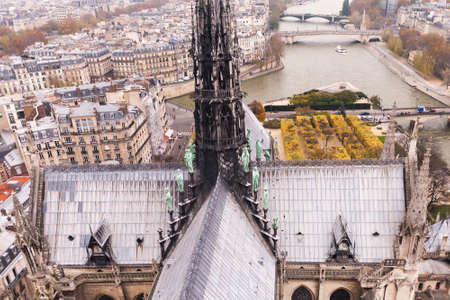 PARIS, FRANCE - NOVEMBER 29, 2013: Gargoyle of the Cathedral of Notre Dame de Paris overlooking Paris, Franceのeditorial素材