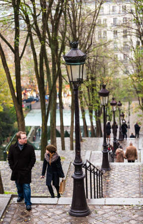 PARIS, FRANCE - NOVEMBER 29, 2013: Tourists in Montmartre. Monmartre area is popular among tourists in Paris, the most visited city worldwide.のeditorial素材