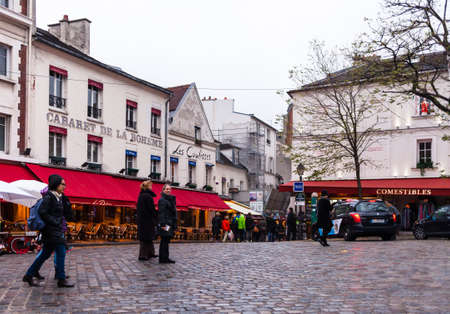 PARIS, FRANCE - NOVEMBER 29, 2013: Tourists in Montmartre. Monmartre area is popular among tourists in Paris, the most visited city worldwide.のeditorial素材