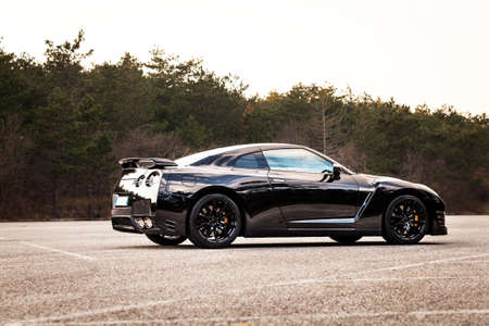 SISTIANA, ITALY JUNE 12, 2013: Photo of a Nissan GT-R Black Edition. The Nissan GT-R is a 2-door 2+2 sports car produced by Nissan and unveiled in 2007.のeditorial素材