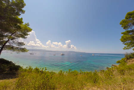 BOL,BRAC,CROATIA - AUGUST 3: Crowded beach of Zlatni Rat on August 03, 2014 in Bol, Croatia. Bol is one of the most famous tourist desinations on the adriatic islands.のeditorial素材