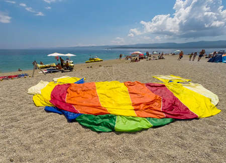 BOL,BRAC,CROATIA - AUGUST 3: Crowded beach of Zlatni Rat on August 03, 2014 in Bol, Croatia. Bol is one of the most famous tourist desinations on the adriatic islands.のeditorial素材