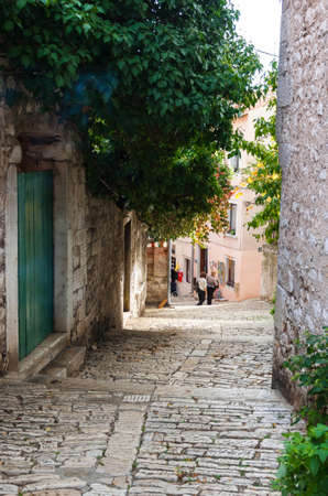 ROVINJ, CROATIA - MAY 29, 2014: Tourist people walk the old town streetsのeditorial素材