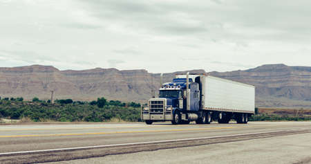 SALT LAKE CITY, UTAH, USA JUNE 12, 2015: Truck on highway. SALT LAKE, UTAH, USA. TONED Image.のeditorial素材