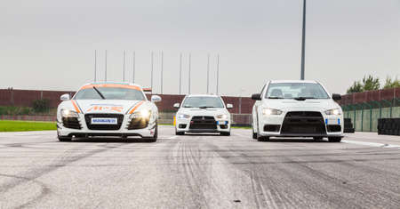 UDINE, Italy - OCTOBER 10, 2012: Audi R8 Safety car M&R Team and two Mitsubishi EVO 10,  exhibition...