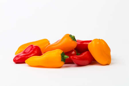 Fresh colorful peppers on white backgroundの写真素材