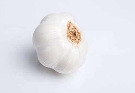 Bulb of garlic isolated on white background with shadow