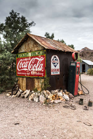 NELSON , USA - JUNE 10 : Old wooden house and rusty old fuel pump in Nelson Nevada ghost town on June 10 ,2015のeditorial素材