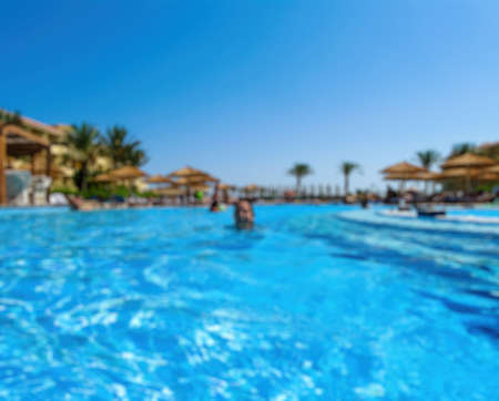 Abstract blurry beautiful luxury swimming pool in hotel resortの写真素材