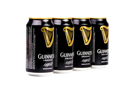 Trieste, Italy July 08 2016: Four Guinness stout aluminum can on the white background. Irish dry...