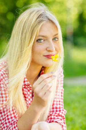 Portrait of young blonde woman with blue eyes.の写真素材