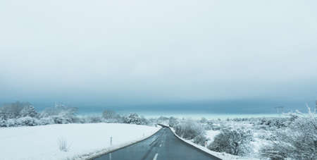 Snow winter road in the amazing snow covered forest.