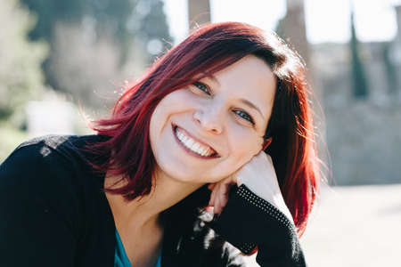 Young handsome woman posing in sunny day