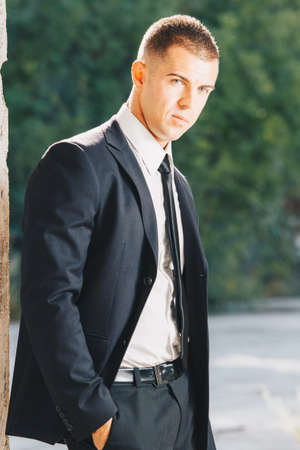Awesome stylish men in elegant suite posing. Elegance and Luxury Man concept.