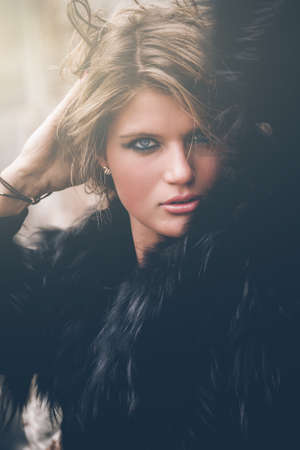 Fashionable young woman posing in, rocky background, quarryの写真素材