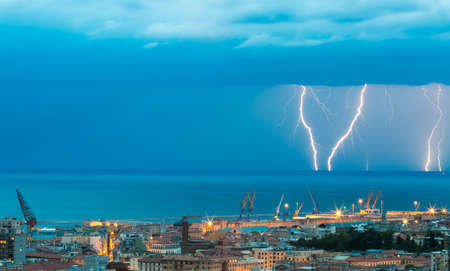 Thunder storm lightning strike on the sea  background at night.の写真素材