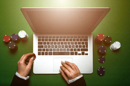 Top view of cropped woman hands using laptop for online casino. Concept virtual leisure activity.の写真素材