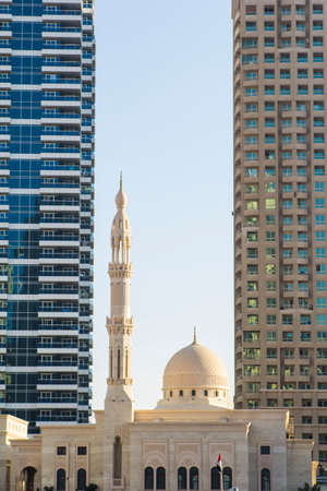 building of the mosque between two skyscrapersの写真素材