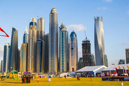 spectator clearing in Skydive Dubai during international competitions parachutism overlooking the towers of Dubai Marinaのeditorial素材