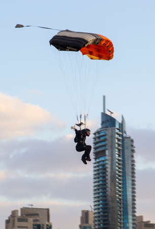 Parachutist prepares for a landing at the international Parachuting Championships in Dubai 2014のeditorial素材