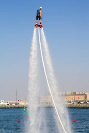 The man rose to the maximum height in the competition for the fly boarding at SkyDiveDubai in Dubai in 2014のeditorial素材