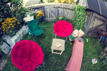 relaxation area for guests on a green summer garden plot