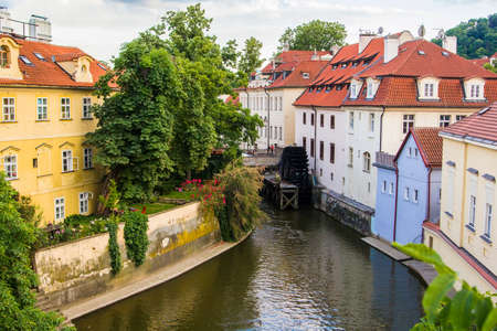 view from the Charles Bridge on the river Devil and watermillの写真素材