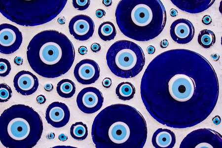 background texture of a wall of concrete and Nazar amulet in Istanbulの写真素材