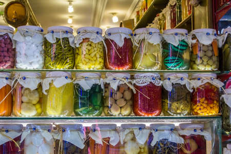 jars of pickled vegetables and fruits at the market in Istanbulの写真素材