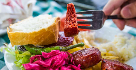 Grill sausages meat with vegetables and rice in a cafe in Istanbulの写真素材