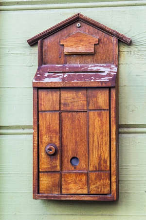 Old wooden mail box on the wallの写真素材