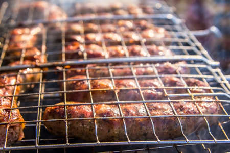 background juicy fried meat sausage Grilling outdoorsの写真素材