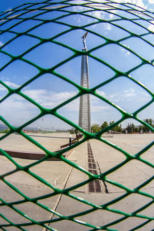 statue with wings of metal on a high pedestal for the metal meshの写真素材