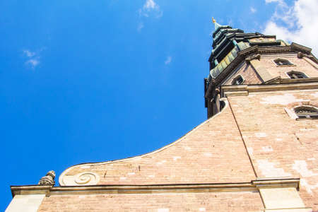 background cityscape view from the bottom of the bell tower of the Cathedral of St. Peter in Riga, Latviaの写真素材