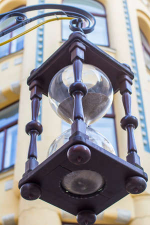 background cityscape huge hourglass on the street