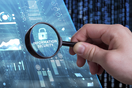 Business, Technology, Internet and network concept. Young businessman working on a virtual screen of the future and sees the inscription: Information securityの写真素材