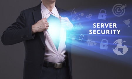 Business, Technology, Internet and network concept. Young businessman shows the word: Server securityの写真素材