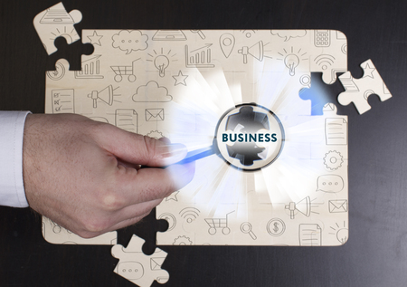Business, Technology, Internet and network concept. Young businessman shows the word: Businessの写真素材