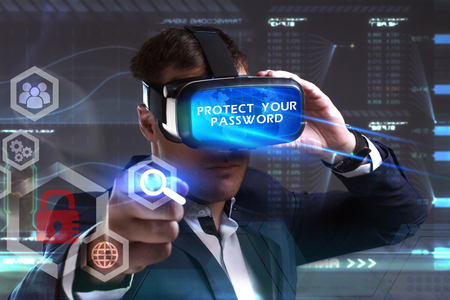 Business, Technology, Internet and network concept. Young businessman working in virtual reality glasses sees the inscription: Protect your passwordの写真素材