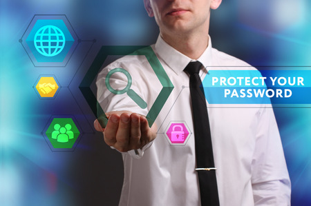 Business, Technology, Internet and network concept. Young businessman working on a virtual screen of the future and sees the inscription: Protect your passwordの写真素材