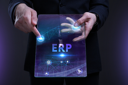 Business, Technology, Internet and network concept. Young businessman working on a virtual screen of the future and sees the inscription: ERPの写真素材