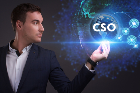 Business, Technology, Internet and network concept. Young businessman working on a virtual screen of the future and sees the inscription: CSOの写真素材