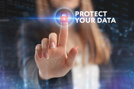 The concept of business, technology, the Internet and the network. A young entrepreneur working on a virtual screen of the future and sees the inscription: Protect your dataの写真素材