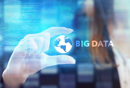 The concept of business, technology, the Internet and the network. A young entrepreneur working on a virtual screen of the future and sees the inscription: Big dataの写真素材