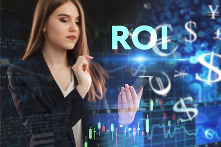 The concept of business, technology, the Internet and the network. A young entrepreneur working on a virtual screen of the future and sees the inscription: ROIの写真素材