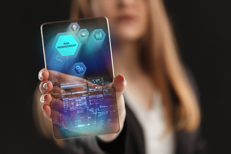 The concept of business, technology, the Internet and the network. A young entrepreneur working on a virtual screen of the future and sees the inscription: Risk managementの写真素材