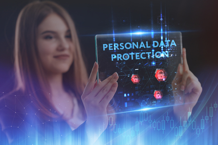 The concept of business, technology, the Internet and the network. A young entrepreneur working on a virtual screen of the future and sees the inscription: Personal data protectionの写真素材