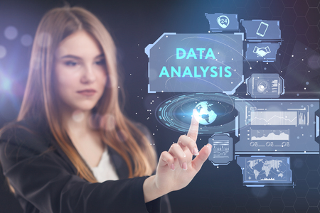 The concept of business, technology, the Internet and the network. A young entrepreneur working on a virtual screen of the future and sees the inscription: Data analysisの写真素材