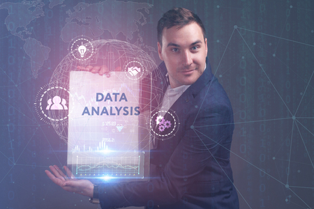 The concept of business, technology, the Internet and the network. A young entrepreneur working on a virtual screen of the future and sees the inscription: Data analysisの写真素材