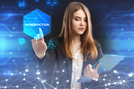 The concept of business, technology, the Internet and the network. A young entrepreneur working on a virtual screen of the future and sees the inscription: introductionの写真素材